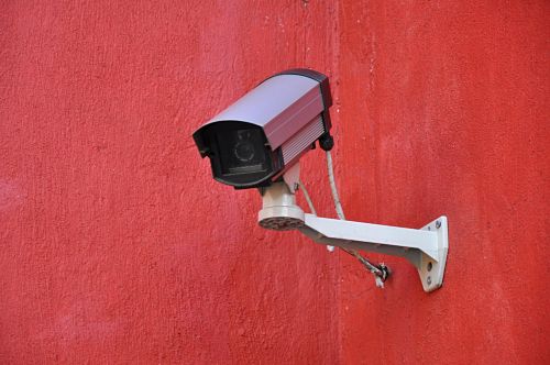 security-camera-on-red-wall